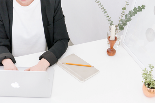 woman working on computer at desk